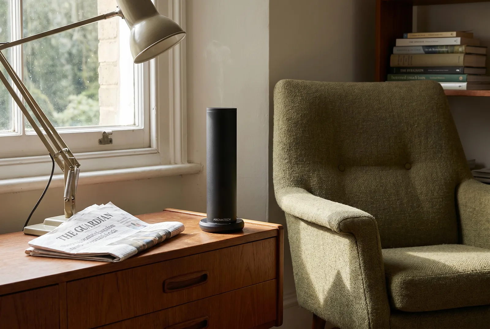 AromaTech AroMini BT Plus diffuser on a sideboard in an open plan living room