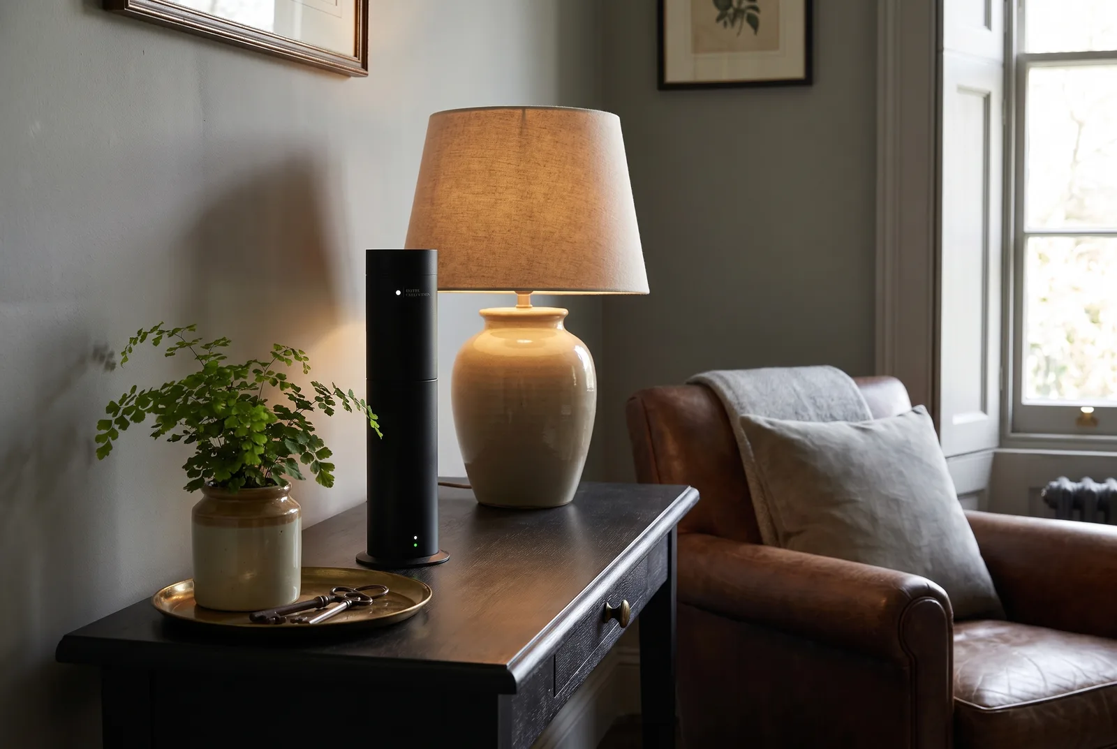 Hotel Collection Studio diffuser on a console table beside folded white towels in hotel style